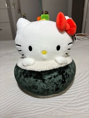 Sanrio Hello Kitty Plush with Red Bow and Dark Green Base